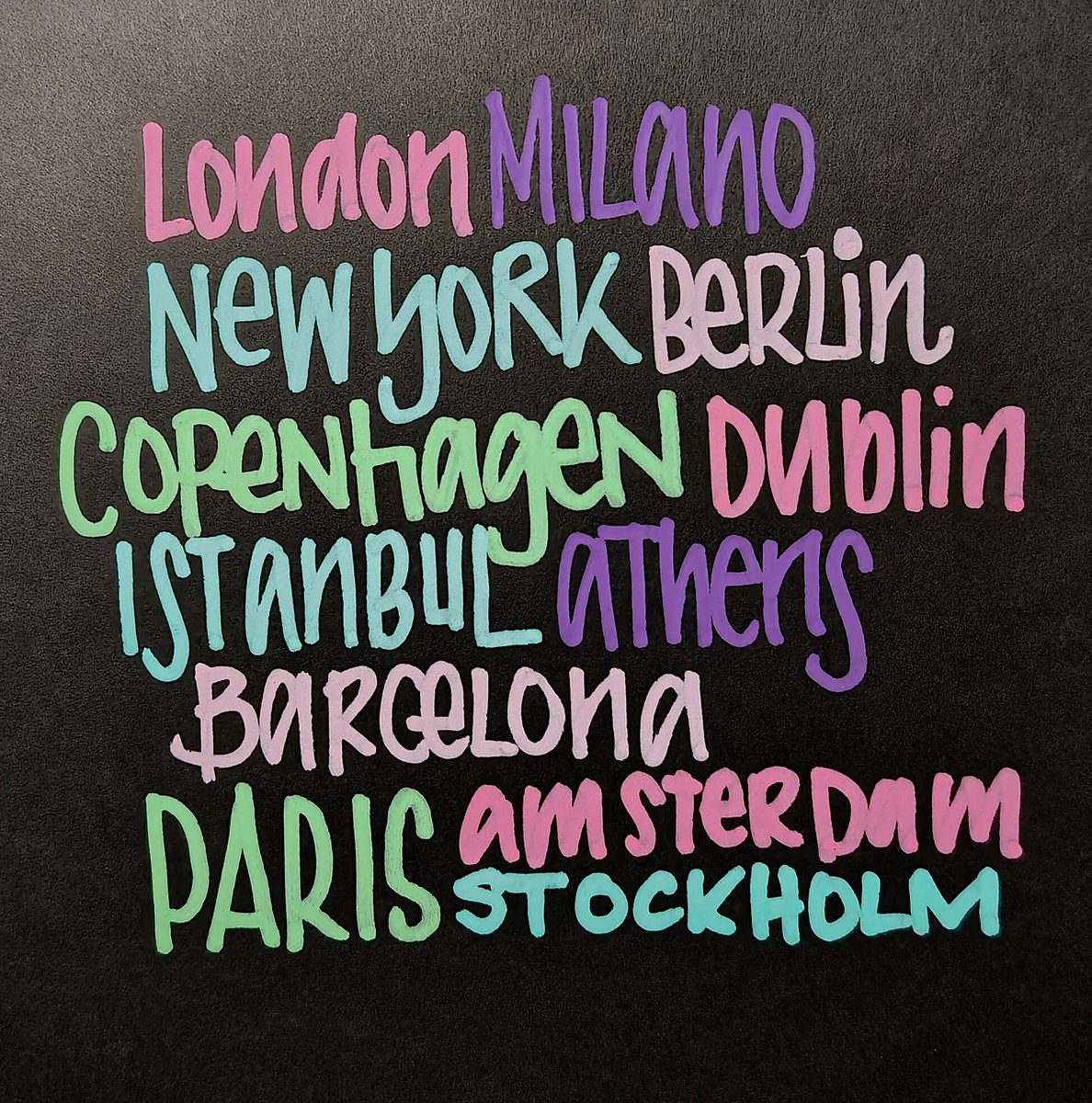 City names in expressive pink, turquoise, purple and green lettering