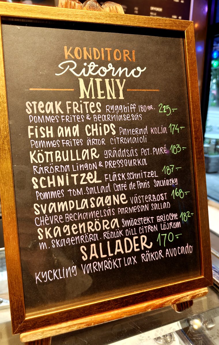 Framed Ritorno menu displayed inside the café