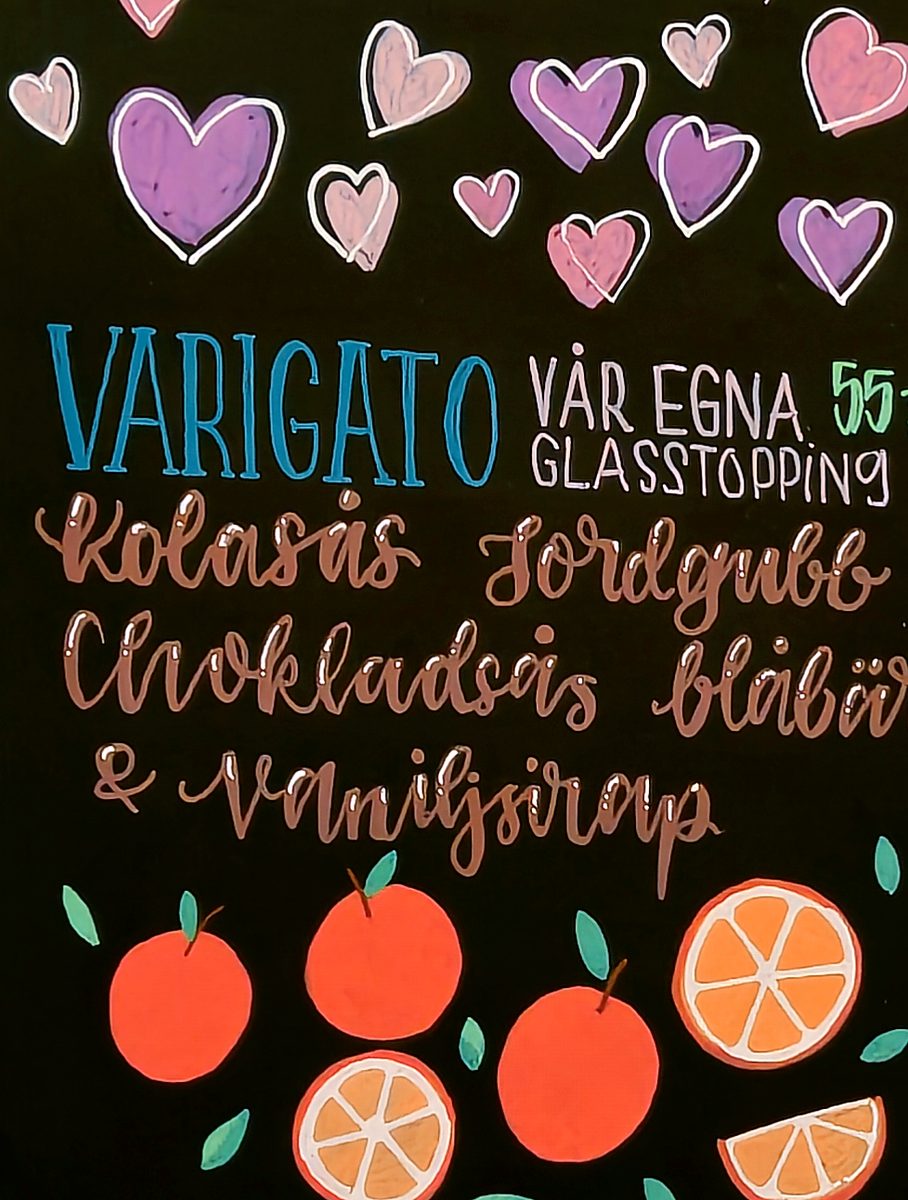 Varigato blackboard with hand lettering, hearts and orange illustrations